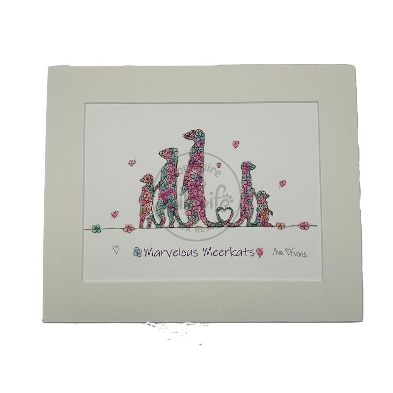 mounted artwork of a family of meerkats with floral patterns on a white background