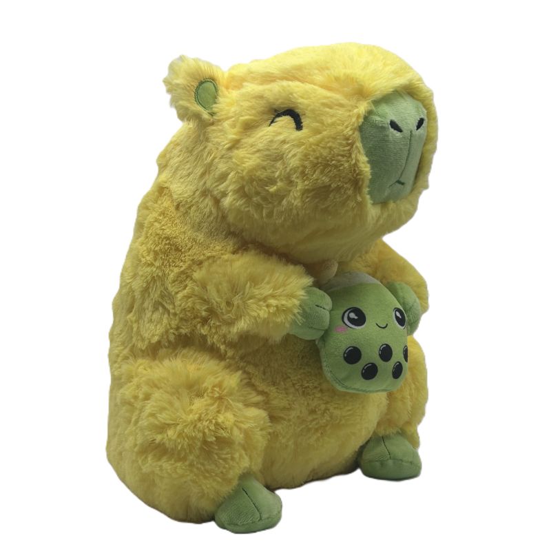 Plush toy with a larger yellow capybara holding a smaller green creature with black spots on a white background