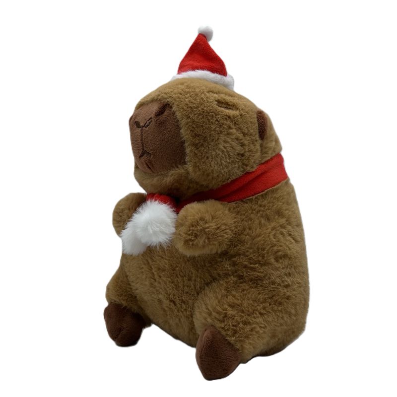 Plush capybara wearing a Santa hat and scarf on a white background