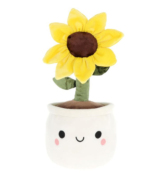 A plush toy resembling a sunflower with a smiling face in a white pot.