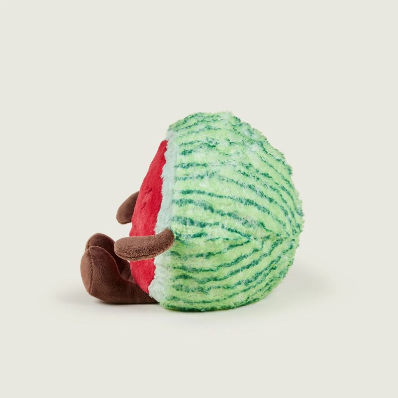 A plush toy resembling a watermelon with a smiling face, green rind, and brown arms.