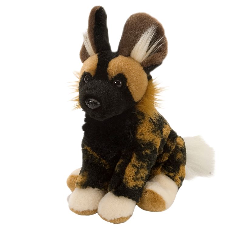 A stuffed African wild dog plush toy sitting on a plain white background. The toy features a mottled black, tan, and brown fur pattern with white paws and a white-tipped tail.