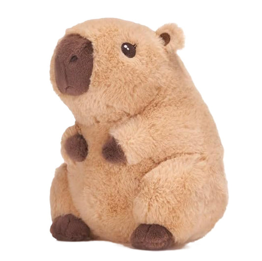 Cream plush toy of a sitting capybara  against a white background
