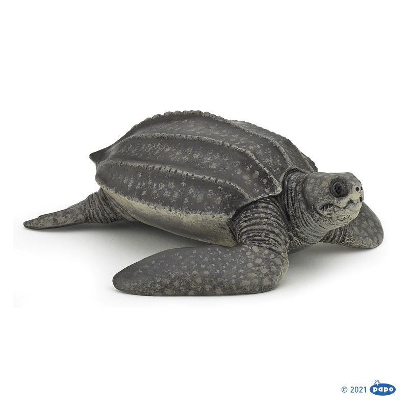 A toy figurine of a leatherback turtle with a gray back shell and dark coloring on a white background.
