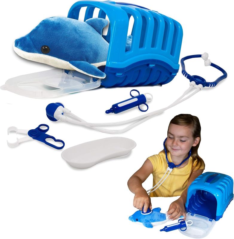 Blue toy dolphin playset set with vet examination kit and a child playing with it on a white background