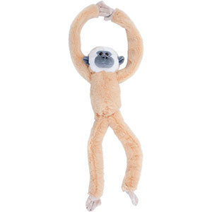 Plush gibbon monkey toy hanging on a white background