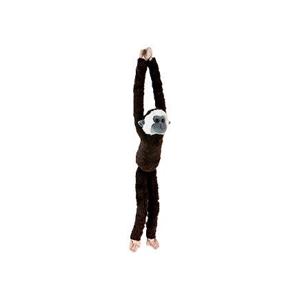 Plush lar gibbon monkey toy hanging on a white background
