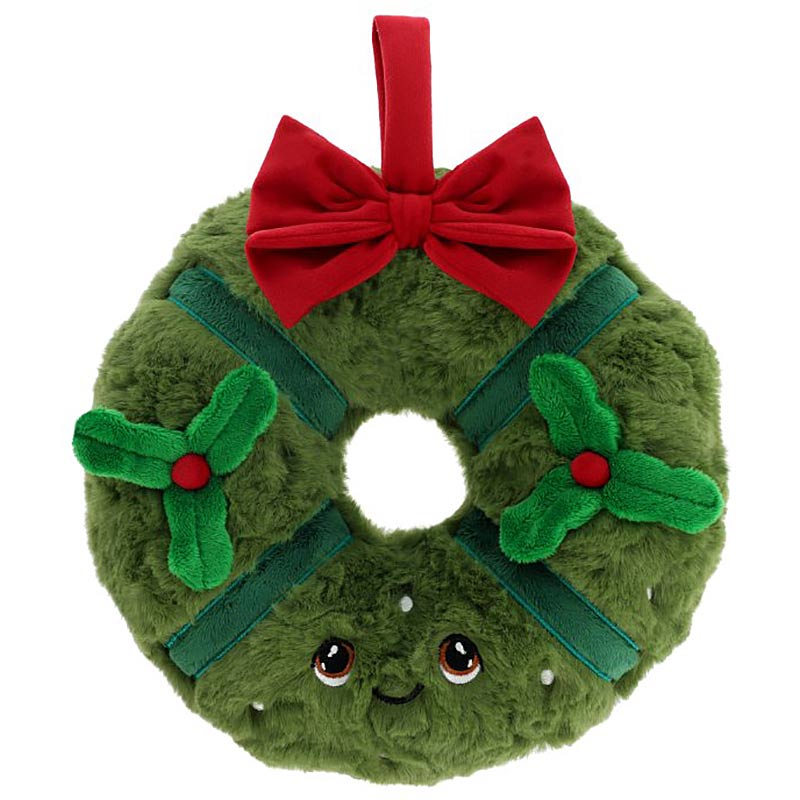 Plush toy shaped like a Christmas wreath with a red bow on a white background