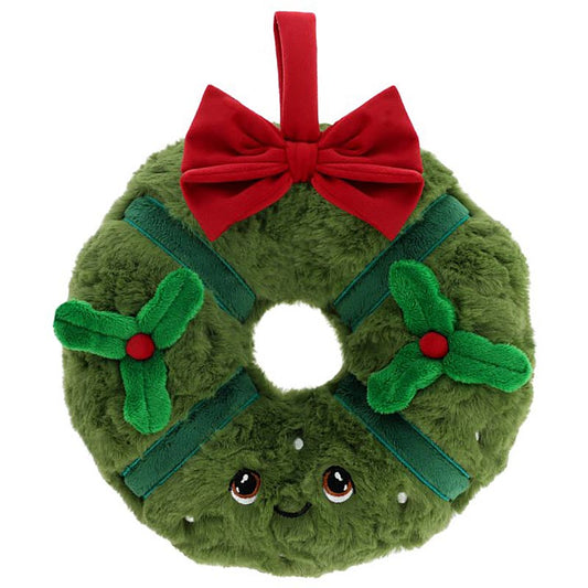 Plush toy shaped like a Christmas wreath with a red bow on a white background