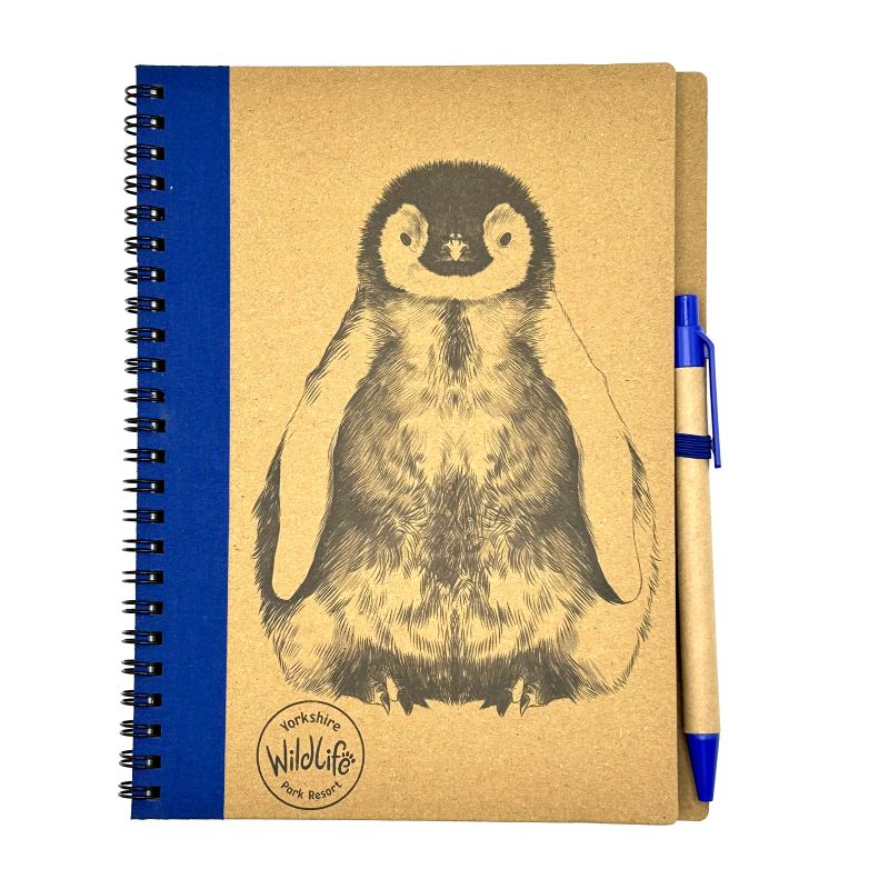 yorkshire wildlife park notebook with penguin illustration and pen on a white background