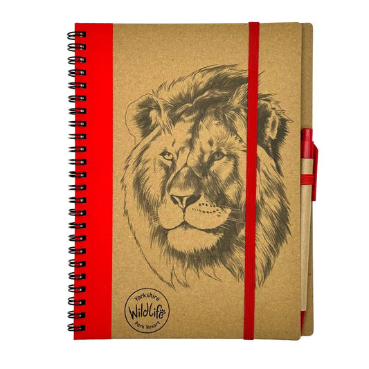 Notebook with lion illustration and red strap on a white background