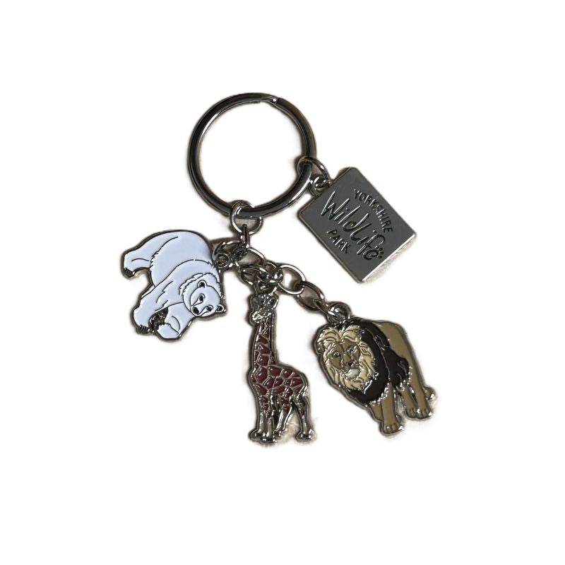 Keychain with animal charms including a polar bear, giraffe, lion and yorkshire wildlife park logo on a white background
