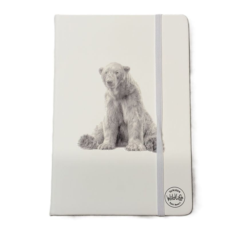 A vertical hardcover notebook with a white cover featuring a detailed grayscale illustration of a polar bear sitting down. The notebook is bound with a gray elastic closure band on the right side, which has a circular 'Wildlife by Wolf' brand logo printed on the lower right.