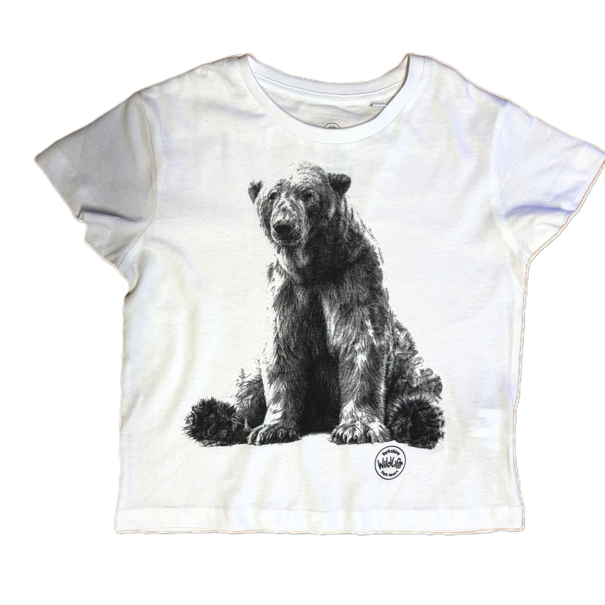A white short-sleeve t-shirt featuring a detailed black and white graphic print of a sitting polar bear on the front, with a small circular logo near the bottom right of the graphic.