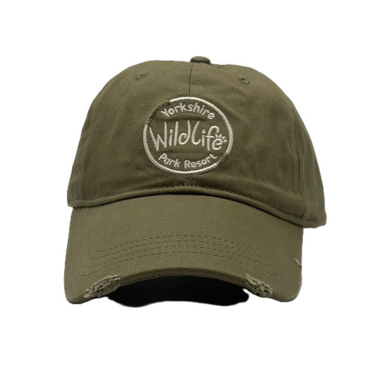 An olive green distressed baseball cap featuring a circular embroidered logo on the front that reads 'Yorkshire Wildlife Park Resort'.
