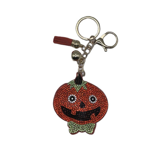 Pumpkin-shaped keychain with rhinestone details on a white background