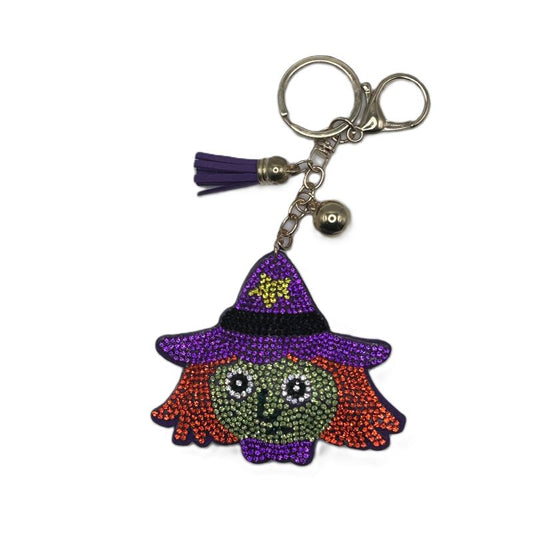 Rhinestone keychain with a witches head design on a white background