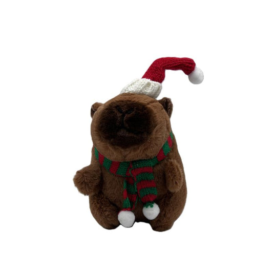 Plush toy capybara wearing a Santa hat and scarf on a white background
