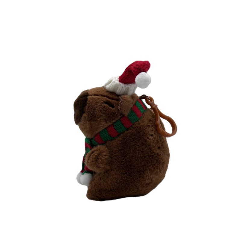 Plush toy capybara with a Santa hat and scarf on a white background