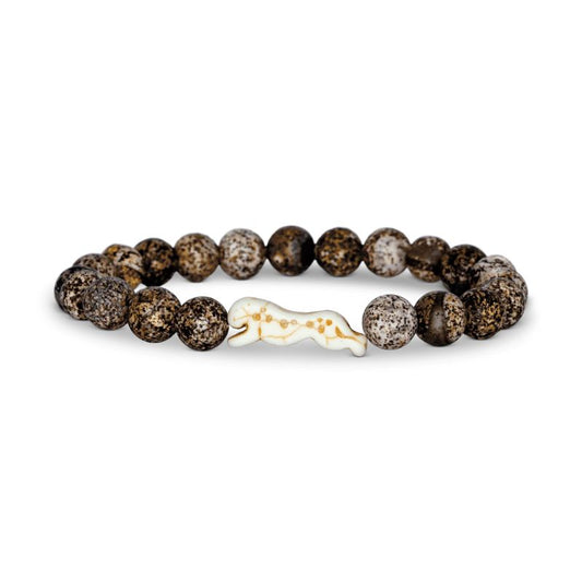 Bracelet with brown beads and a white cheetah charm on a white background