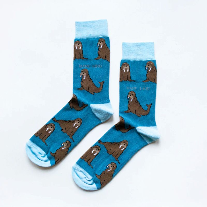 Blue socks with walrus pattern on a white background