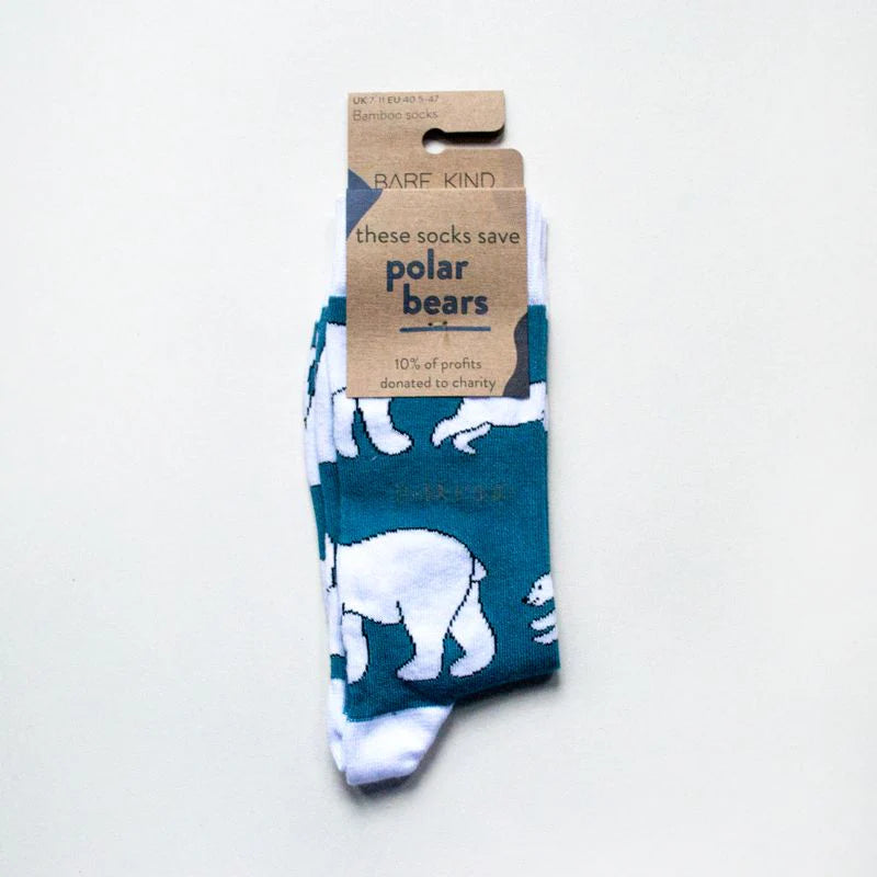 Socks with polar bear design and a visible brand label on a light gray background