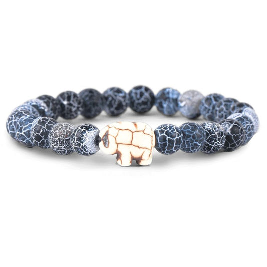 Bracelet with blue and gray marbled beads and a white elephant charm on a white background