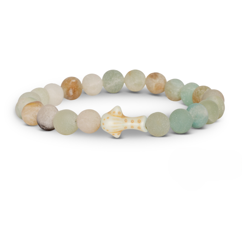 Multicolored beaded bracelet with a whale shark charm on a white background