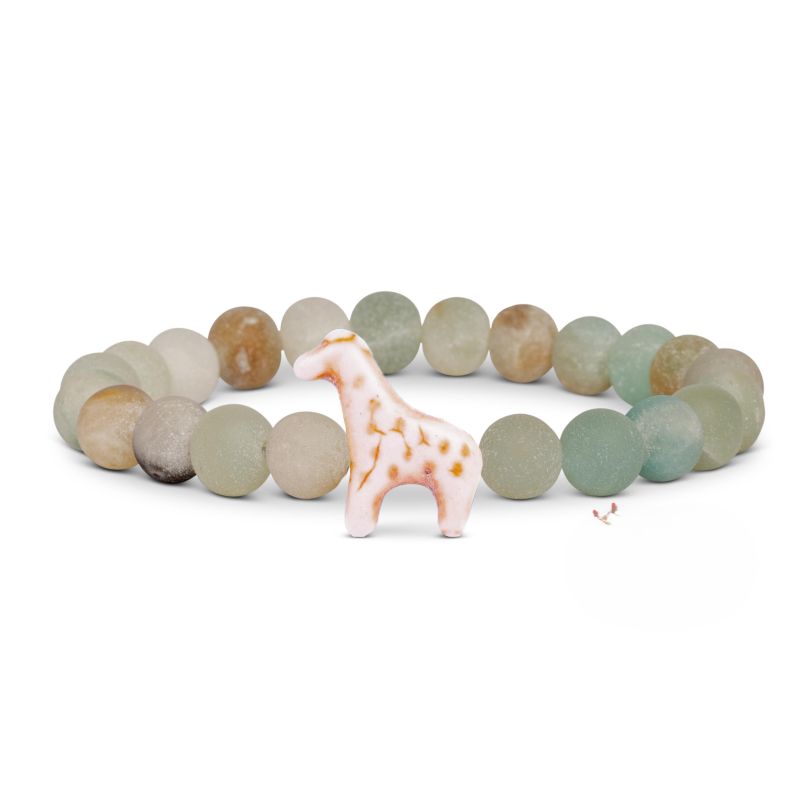 Bracelet with pastel beads and a small giraffe charm on a white background
