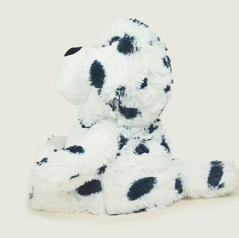 A plush Dalmatian toy with black spots on a white background, designed to be heatable and scented with lavender.