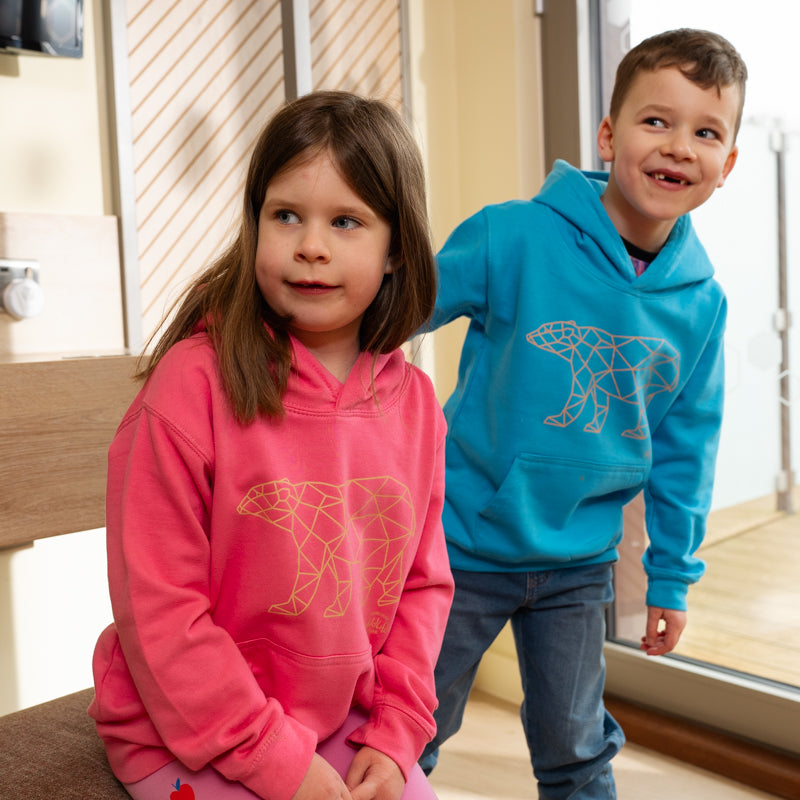 boy and girl wearing yorkshire wildlife park geometric polar bear kids hoodie with geometric polar bear design