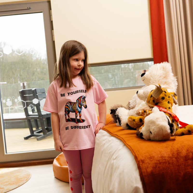 yorkshire wildlife park kids be yourself be different girl wearing pink tshirt with rainbow coloured giraffe