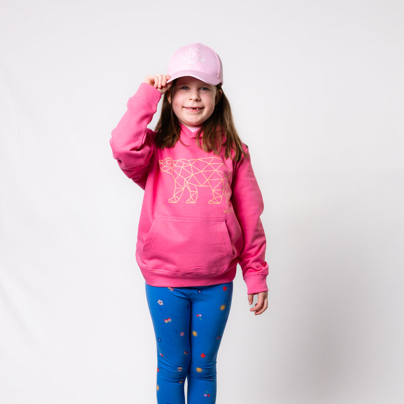 girl wearing yorkshire wildlife park geometric polar bear kids pink hoodie with geometric polar bear design