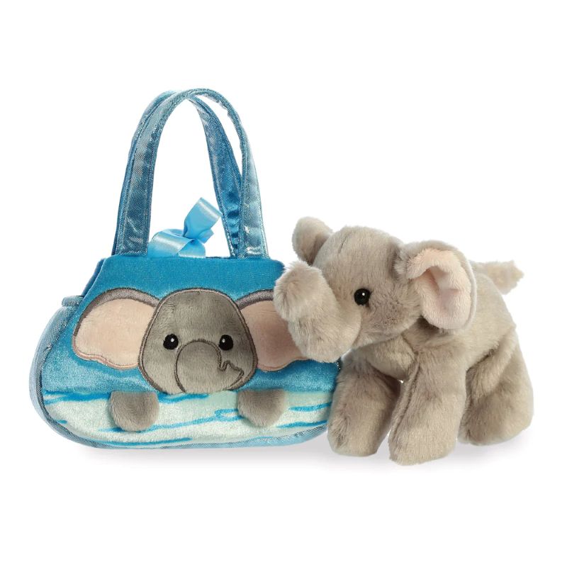 Plush elephant toy next to a blue handbag with an elephant design on a white background