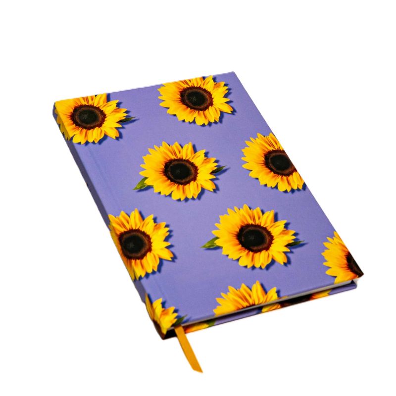 Notebook with sunflower pattern on a purple background